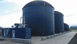 large gray cylindrical anaerobic tanks